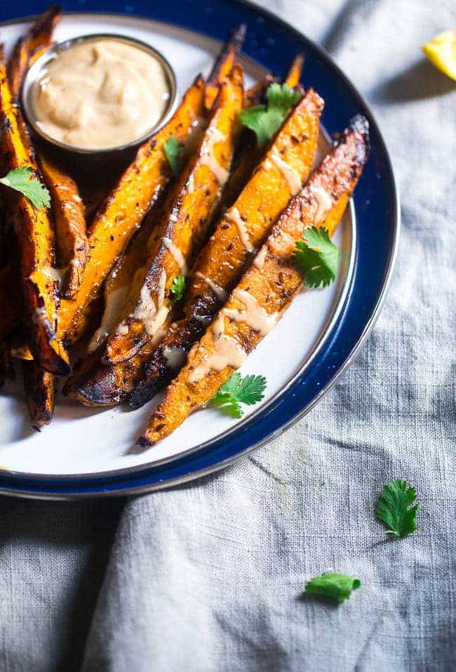Maple Tahini Grilled Sweet Potatoes - Grilled sweet potatoes are dipped into a creamy, sweet dip of maple syrup and tahini for an easy, paleo and vegan friendly side dish. A perfect, healthy summer side dish! | FoodFaithfitness.com | @FoodFaithFit