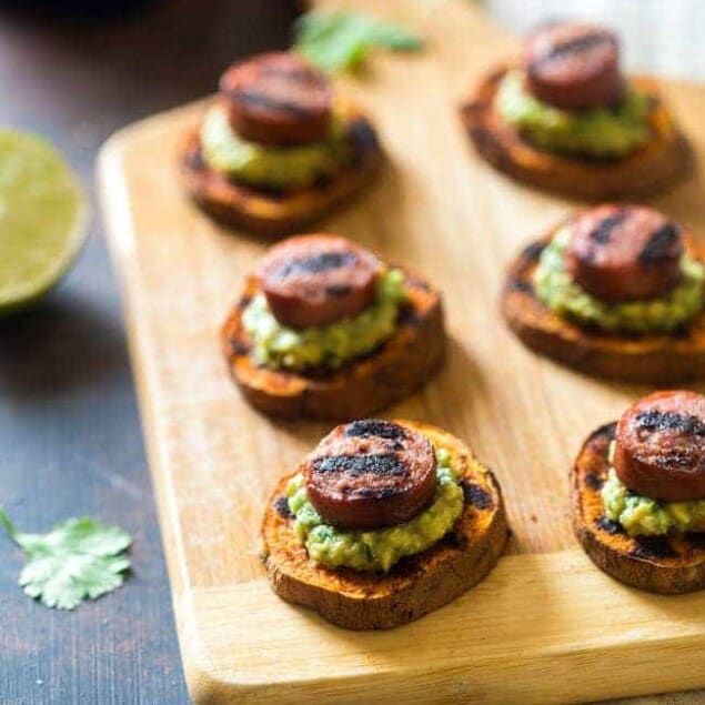 Spicy Grilled Sweet Potatoes with Avocado Salsa and Turkey Sausage - Grilled Sweet Potatoes are covered with creamy, smooth avocado salsa and turkey sausage for a quick, easy and healthy appetizer! Perfect for summer entertaining! | Foodfaithfitness.com | @FoodFaithFit
