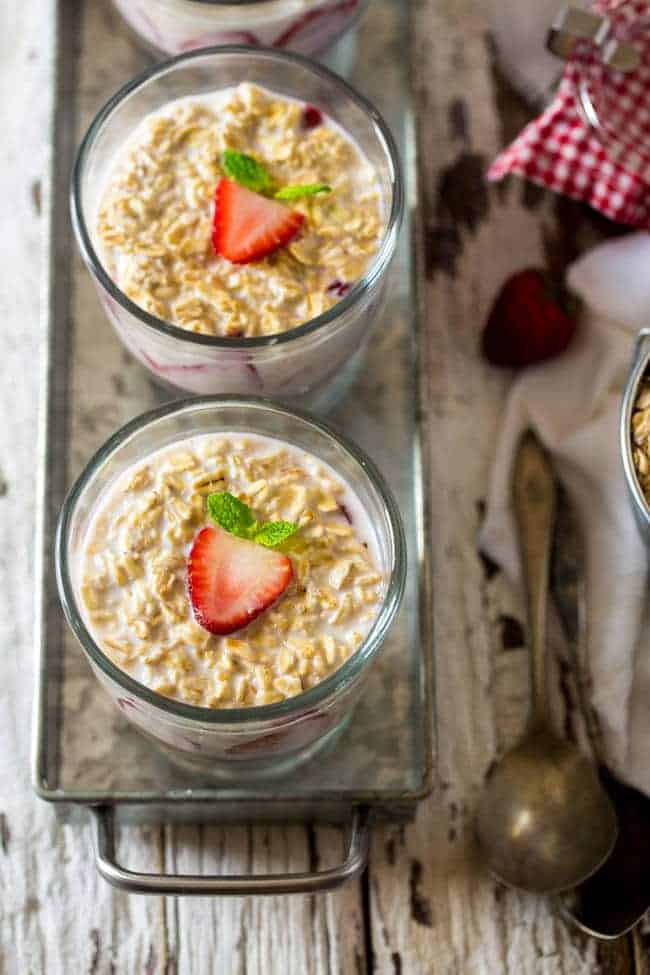 Strawberry Cheesecake Overnight Oats - These overnight oats are layered with a mixture of strawberry jam, cream cheese and Greek yogurt for a quick and easy, high-protein breakfast that feels like dessert! | Foodfaithfitness.com | @FoodFaithFit