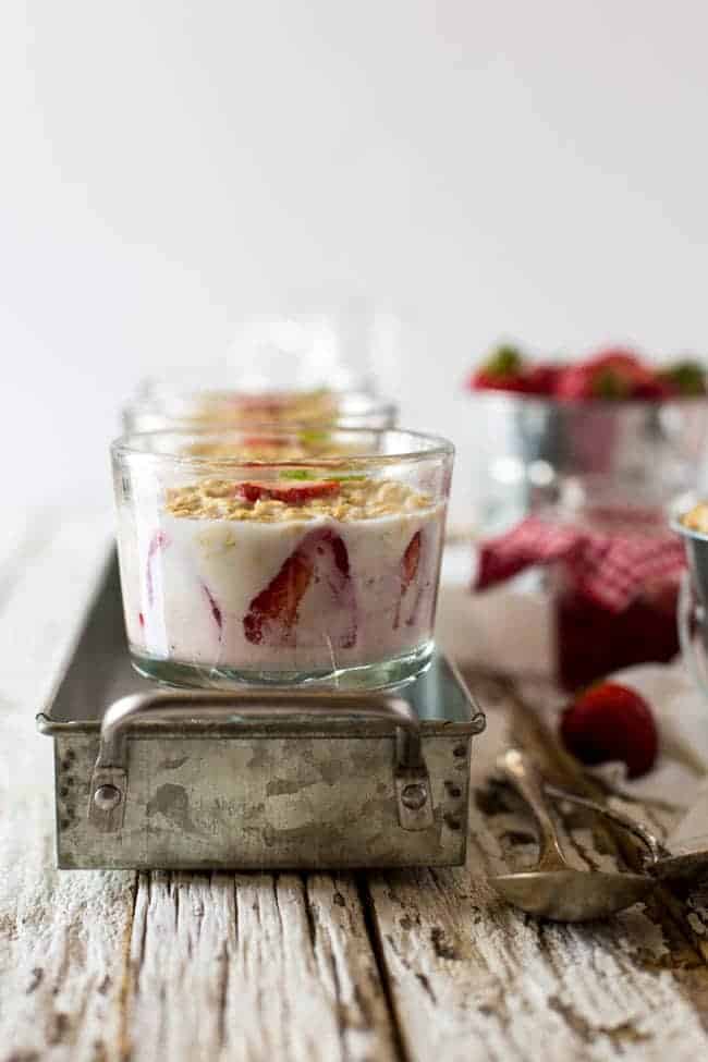 Strawberry Cheesecake Overnight Oats - These overnight oats are layered with a mixture of strawberry jam, cream cheese and Greek yogurt for a quick and easy, high-protein breakfast that feels like dessert! | Foodfaithfitness.com | @FoodFaithFit