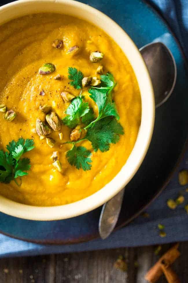 Vegan + Paleo Moroccan Apple, Carrot and Pistachio Cauliflower Soup - This easy, healthy soup is blended with spicy Moroccan flavors, carrots, apples and pistachio cream for an easy, vegan and paleo-friendly fall meal! | Foodfaithfitness.com | @FoodFaithFit