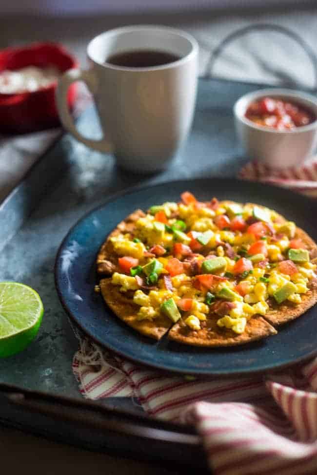 Homemade Healthy Breakfast Nachos - These spicy, healthy nachos are loaded with bacon, scrambled eggs, cheese and a Greek yogurt salsa for an easy, high protein & gluten free breakfast! | Foodfaithfitness.com | @FoodFaithFit