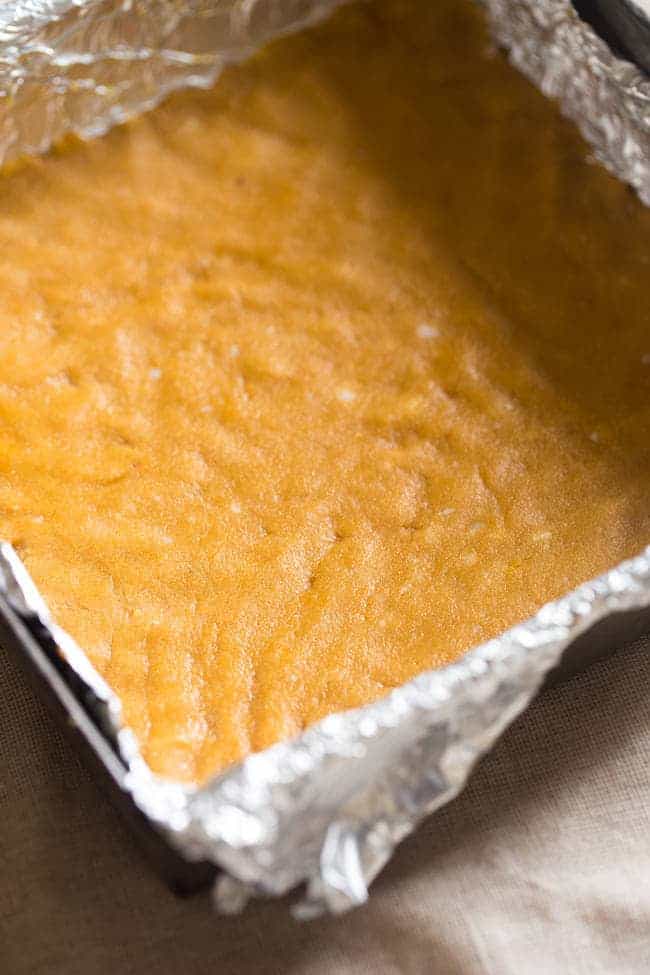 Gluten Free Healthy Pumpkin Cheesecake Bars - These pumpkin cheesecake bars are so creamy, that you'd never know they're secretly healthy, naturally sweetened, gluten free, and only 150 calories! | Foodfaithfitness.com | @FoodFaithFit