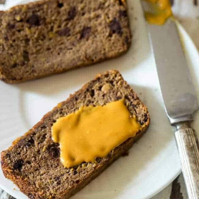 Paleo Chocolate Almond Butter Banana Bread - This easy, healthy Paleo banana bread is made extra delicious with almond butter and chocolate! It's a gluten free, portable breakfast or snack! | Foodfaithfitness.com | @FoodFaithFit