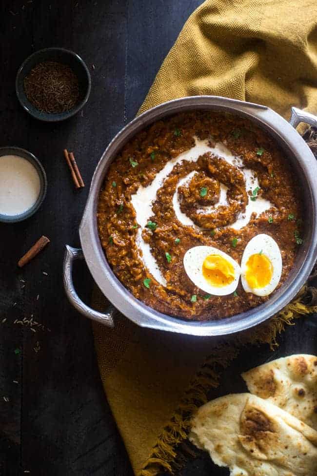 Slow Cooker Pumpkin Coconut Quinoa Egg Curry - This slow cooker curry is mixed with coconut milk, pumpkin, quinoa and topped with boiled eggs for an easy, healthy, fall meal for meatless Monday. Easily vegan friendly! | Foodfaithfitness.com | @FoodFaithFitness
