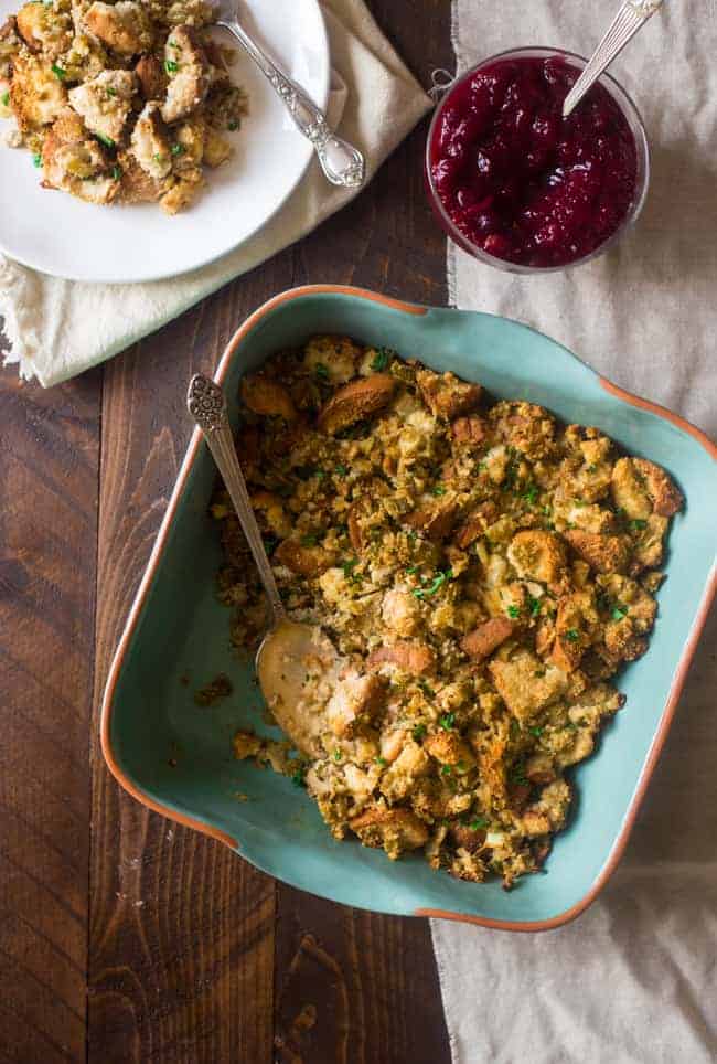 Easy Gluten Free Stuffing in a serving dish on a wooden table