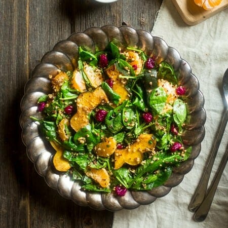 Vegan Maple Tahini Orange Roasted Acorn Squash and Cranberry Quinoa Salad - This healthy salad is mixed with maple roasted acorn squash, cranberries and oranges for a fall meal that is gluten free and vegan friendly. Perfect for Thanksgiving of Friendsgiving! | Foodfaithfitness.com | @FoodFaithFit