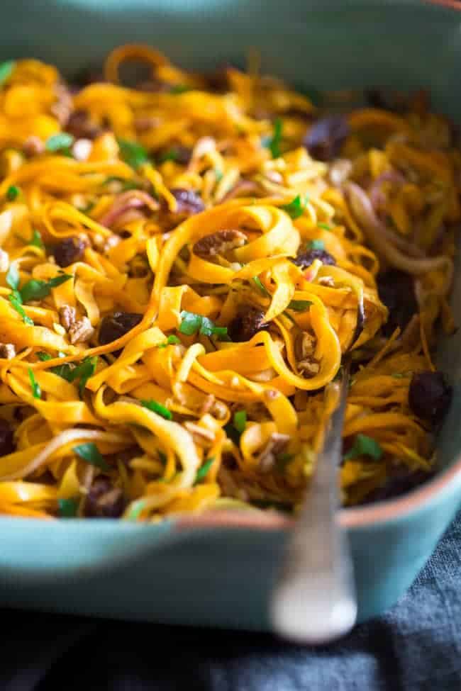 Paleo & Vegan Curried Maple Spiralized Apple and Butternut Squash Salad - This salad is full of apples, dates and pecans. It has a spicy-sweet flavor and is a healthy, paleo and vegan friendly side dish! Perfect for Thanksgiving! | Foodfaithfitness.com | @FoodFaithFit