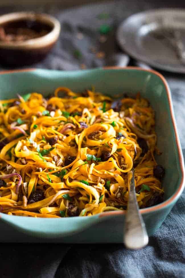 Paleo & Vegan Curried Maple Spiralized Apple and Butternut Squash Salad - This salad is full of apples, dates and pecans. It has a spicy-sweet flavor and is a healthy, paleo and vegan friendly side dish! Perfect for Thanksgiving! | Foodfaithfitness.com | @FoodFaithFit