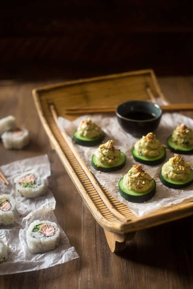 Low Carb California Roll Sushi Bites - Made of creamy Greek yogurt, avocado and crab meat and topped on a cucumber. They're a healthy, low carb and gluten free snack, or appetizer, that tastes like an California Roll, for only 40 calories! | Foodfaithfitness.com | @FoodFaithFit