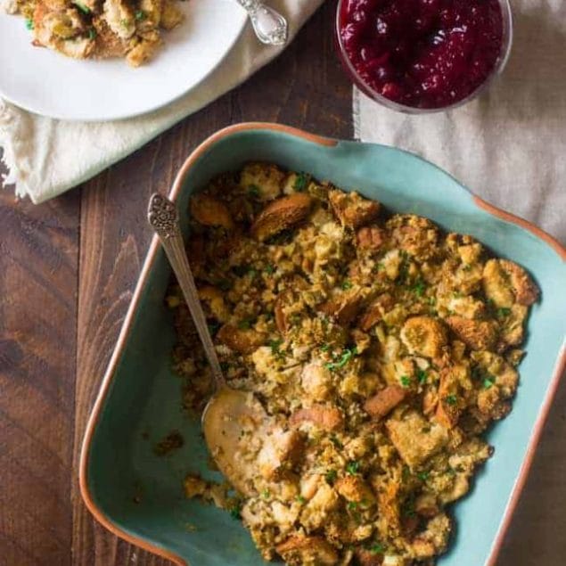 Easy Gluten Free Stuffing in a serving dish on a wooden table