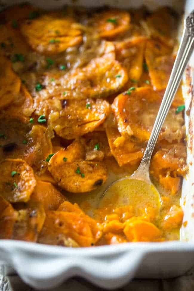 Paleo + Vegan Scalloped Sweet potatoes - These potatoes are SO creamy and flavorful, you'll have a hard time believing they're secretly healthy and paleo and vegan friendly! Perfect for Thanksgiving! | Foodfaithfitness.com | @FoodFaithFit
