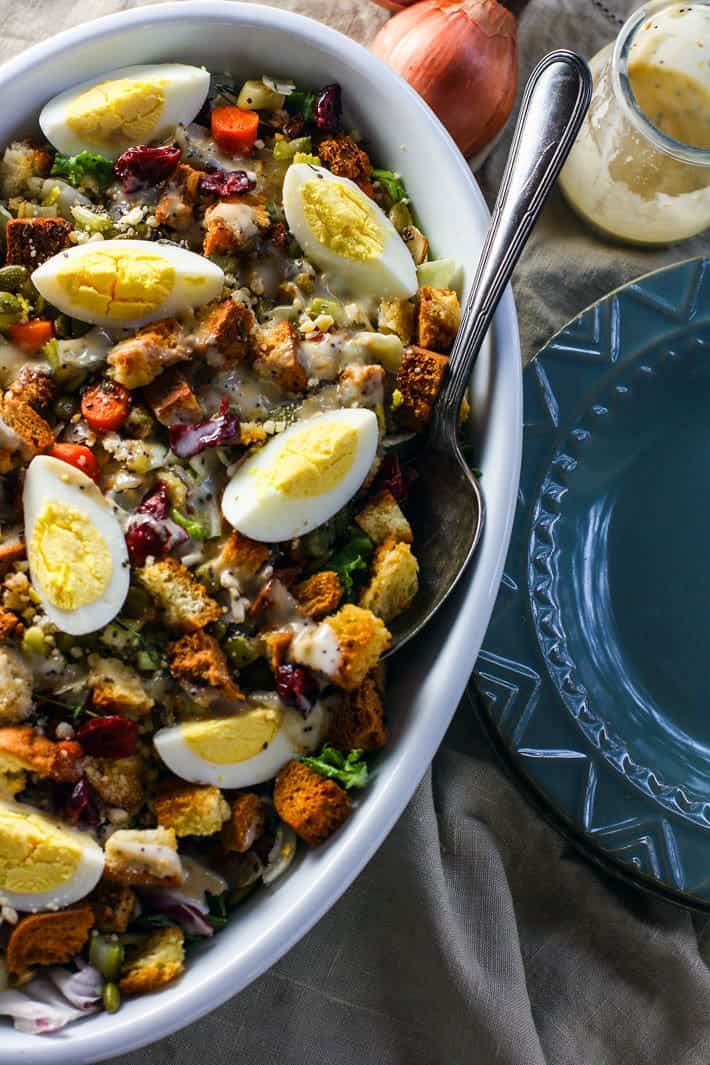 Vegan Maple Tahini Orange Roasted Acorn Squash and Cranberry Quinoa Salad - This healthy salad is mixed with maple roasted acorn squash, cranberries and oranges for a fall meal that is gluten free and vegan friendly. Perfect for Thanksgiving of Friendsgiving! | Foodfaithfitness.com | @FoodFaithFit