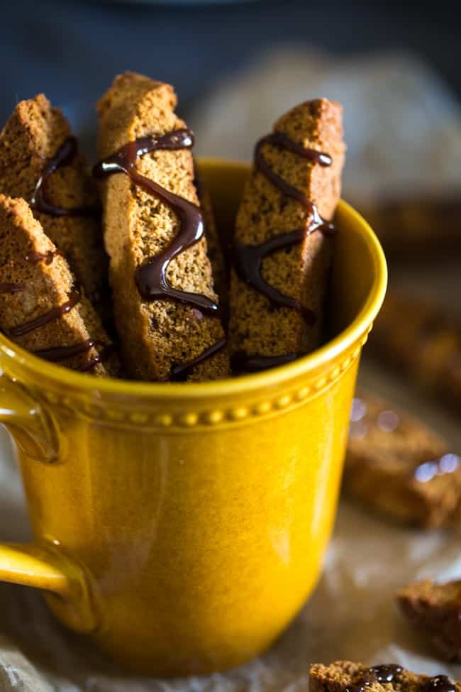 Gluten Free Gingerbread Biscotti with Coffee Glaze - These Gingerbread gluten free biscotti are made with oat flour and have a sweet coffee glaze! They're a healthy Christmas cookie that are only 106 calories! | Foodfaithfitness.com | @FoodFaithFit