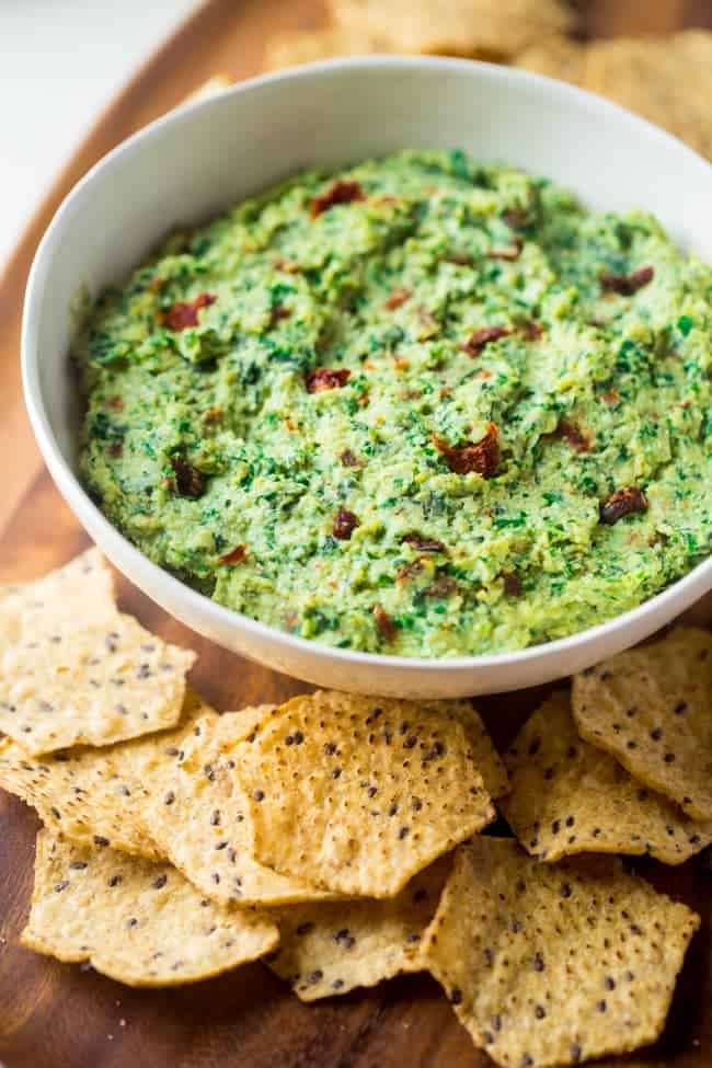 Vegan Kale Pesto Easy Homemade Hummus without Tahini - This quick and easy, vegan homemade hummus features kale pesto and sun dried tomatoes. It's a healthy, gluten free appetizer or snack! | #Foodfaithfitness | #Vegan #Glutenfree #healthy #appetizer