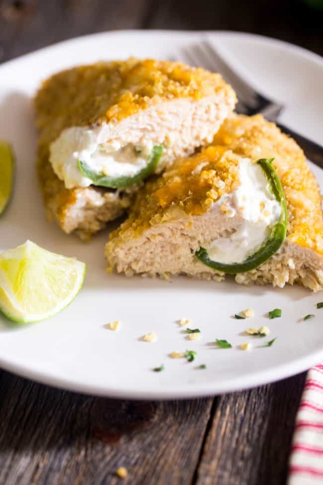 Quinoa Crusted Jalapeno Popper Chicken - This crowd-pleasing chicken tastes like the popular party food, but is made healthy and gluten free with a quinoa crust! Perfect for busy, weeknight meals! | Foodfaithfitness.com | @FoodFaithFit