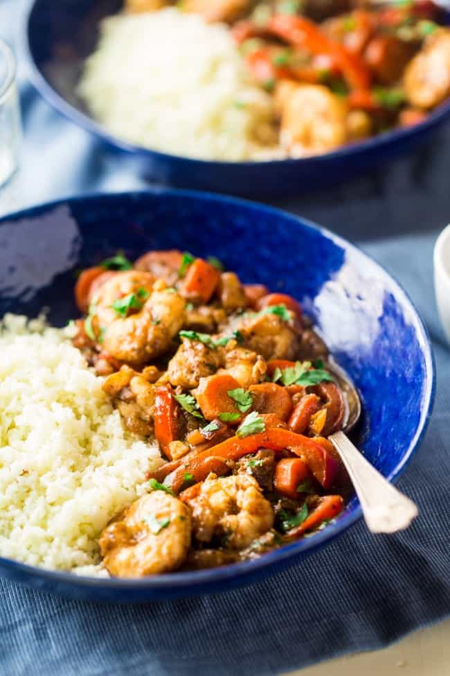 Whole 30 Jerk Shrimp Stew with Cauliflower Rice - This creamy stew uses coconut milk, pineapples and bold flavors for a healthy, 30 minute weeknight meal that is paleo friendly and whole 30 compliant! | Foodfaithfitness.com