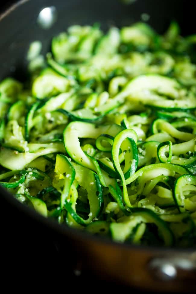 Pesto zoodles in a skillet