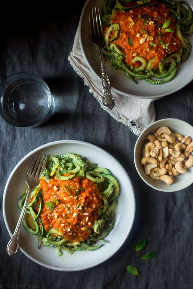 Vegan Lentil Coconut Curry with Cashew Cilantro Pesto Cucumber Noodles - Spiralized cucumbers are mixed with a flavorful pesto and then topped with creamy lentil coconut curry for a healthy, vegan friendly, weeknight meal! | Foodfaithfitness.com | @FoodFaithFit
