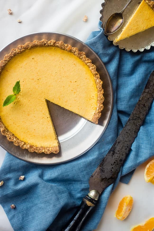 Gluten Free Orange Pie with Almond Crust - This easy, healthy orange pie uses a secret ingredient to make it PACKED with protein and low in calories! It's perfect for breakfast, snack or dessert! | Foodfaithfitness.com | @FoodFaithFit