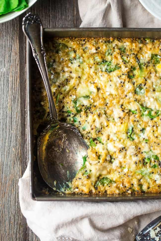Spinach and Artichoke Quinoa Casserole with Cauliflower Alfredo Sauce - This creamy, gluten free quinoa casserole tastes like spinach and artichoke dip in a healthy, weeknight dinner form! No one will it has hidden veggies and is only 180 calories and 5 SmartPoints! | Foodfaithfitness.com | @FoodFaithFit