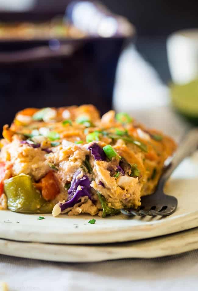 Rainbow Thai Peanut Chicken Cauliflower Casserole - This healthy casserole has the taste of Thai peanut sauce, chicken and lots of fresh veggies! It's a low carb and gluten free weeknight meal that's only 220 calories and 5 SmartPoints! | Foodfaithfitness.com | @FoodFaithFit