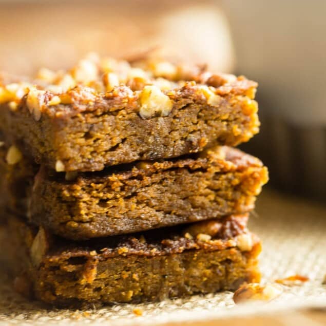 Gluten Free Vegan Carrot Cake Blondies - These carrot cake blondies are dense, chewy and spicy-sweet! You'd never know they're a healthy, paleo-friendly treat for only 100 calories! Perfect for Easter! | Foodfaithfitness.com | @FoodFaithFit