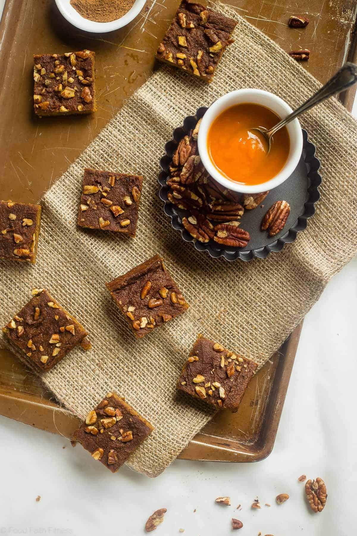 Gluten Free Vegan Carrot Cake Blondies - These carrot cake blondies are dense, chewy and spicy-sweet! You'd never know they're a healthy, paleo-friendly treat for only 100 calories! Perfect for Easter! | Foodfaithfitness.com | @FoodFaithFit