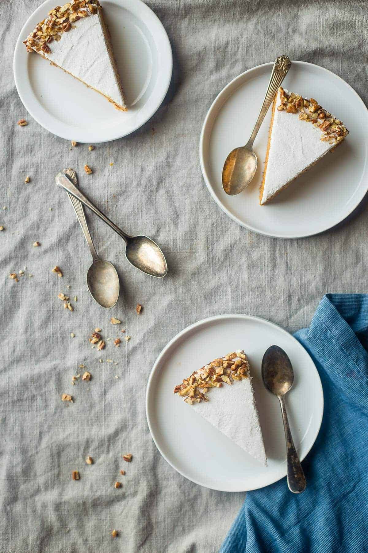 Gluten Free Paleo And Vegan Carrot Cake Cheesecake - This super easy, rich, creamy, paleo and vegan friendly cheesecake tastes like carrot cake but is secretly dairy, gluten, egg and refined sugar free and healthy! Perfect for Easter! | Foodfaithfitness.com | @FoodFaithFit