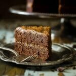Paleo German Chocolate Cake - You'd never know this rich, moist German Chocolate Cake is a healthy remake that is paleo friendly and gluten, grain, oil, butter and refined sugar free! | Foodfaithfitness.com | @FoodFaithFit