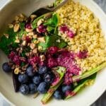 Vegan Blueberry Cacao Superfood Quinoa Salad - This healthy quinoa salad recipe has almonds, cacao nibs and a blueberry vinaigrette. It's an easy, gluten free and vegan meal that's packed with superfoods for only 360 calories!| Foodfaithfitness.com | @FoodFaithFit