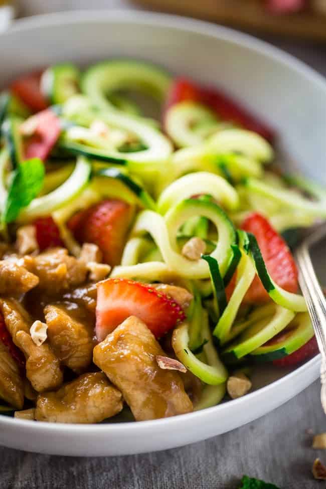 Paleo Strawberry Rhubarb Chicken Stir Fry with Zucchini Noodles - Strawberry Rhubarb is not just for pie anymore! This easy healthy chicken stir fry is a gluten free weeknight spring meal for only 350 calories! | Foodfaithfitness.com | @FoodFaithFit