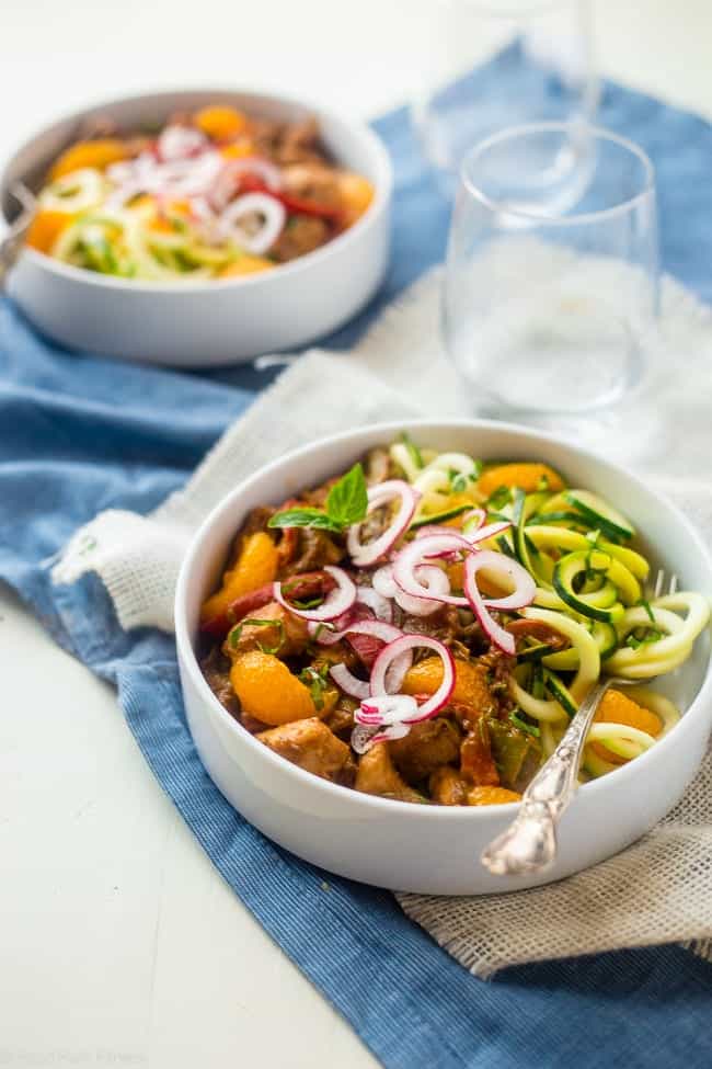 Orange Almond Chicken Stir Fry with Zucchini Noodles - This healthy chicken stir fry has spring vegetables and a creamy, orange almond & Dijon sauce. Serve it over zucchini noodles for a healthy, Whole30 compliant, easy weeknight dinner! | Foodfaithfitness.com | @FoodFaithFit