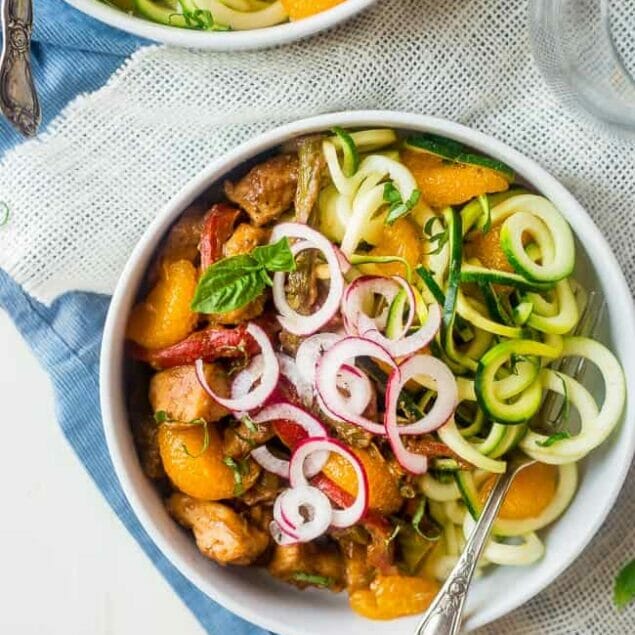 Paleo Orange Almond Chicken Stir Fry with Zucchini Noodles - This healthy chicken stir fry has spring vegetables and a creamy, orange almond & Dijon sauce. Serve it over zucchini noodles for a healthy, Whole30 compliant, easy weeknight dinner! | Foodfaithfitness.com | @FoodFaithFit