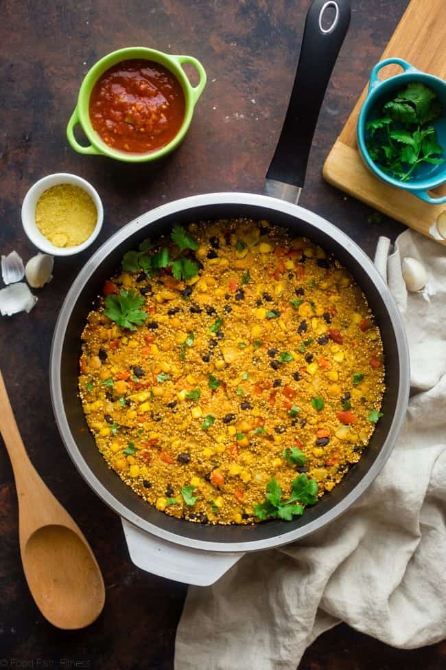 Vegan "Cheesy" Mexican Quinoa - This easy, one-pan meal has a spicy, cheesy taste - without the cheese! It's a healthy and gluten free, vegan-friendly weeknight meal that is under 300 calories! | Foodfaithfitness.com | @FoodFaithFit