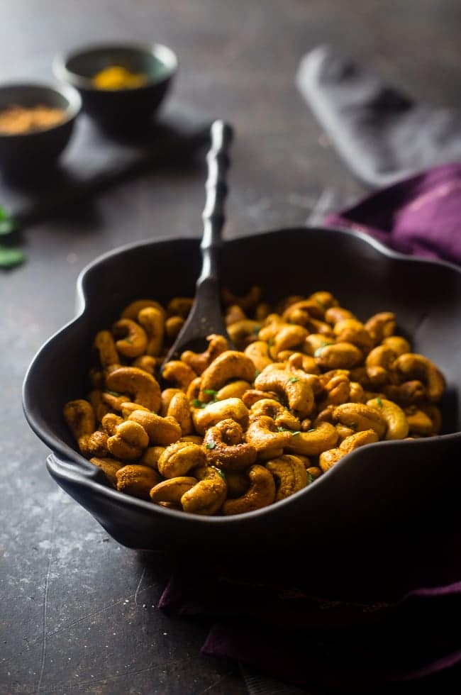 Thai Curry Roasted Cashews - These gluten free, 4 ingredient roasted cashews have a spicy-sweet Thai curry kick! They're a quick and easy, paleo and vegan friendly and snack for on the go eating! | Foodfaithfitness.com | @FoodFaithFit