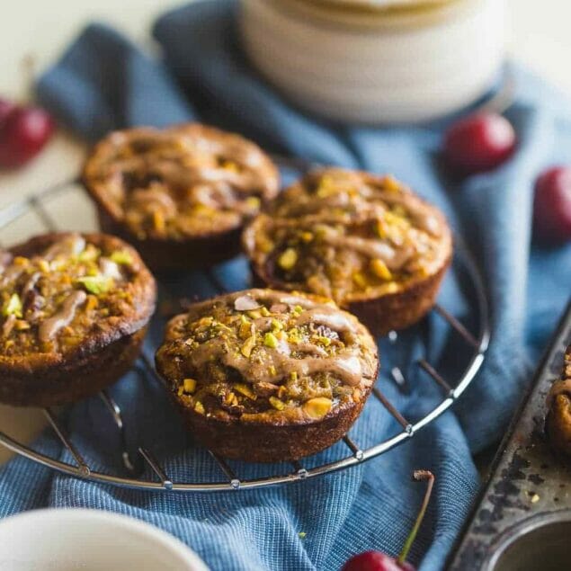 Almond, Cherry and Apricot Quinoa Muffins - These spicy-sweet, healthy quinoa muffins are packed with roasted cherries and apricots! They're an easy, portable breakfast or snack that's gluten free and kid friendly! | Foodfaithfitness.com | @FoodFaithFit