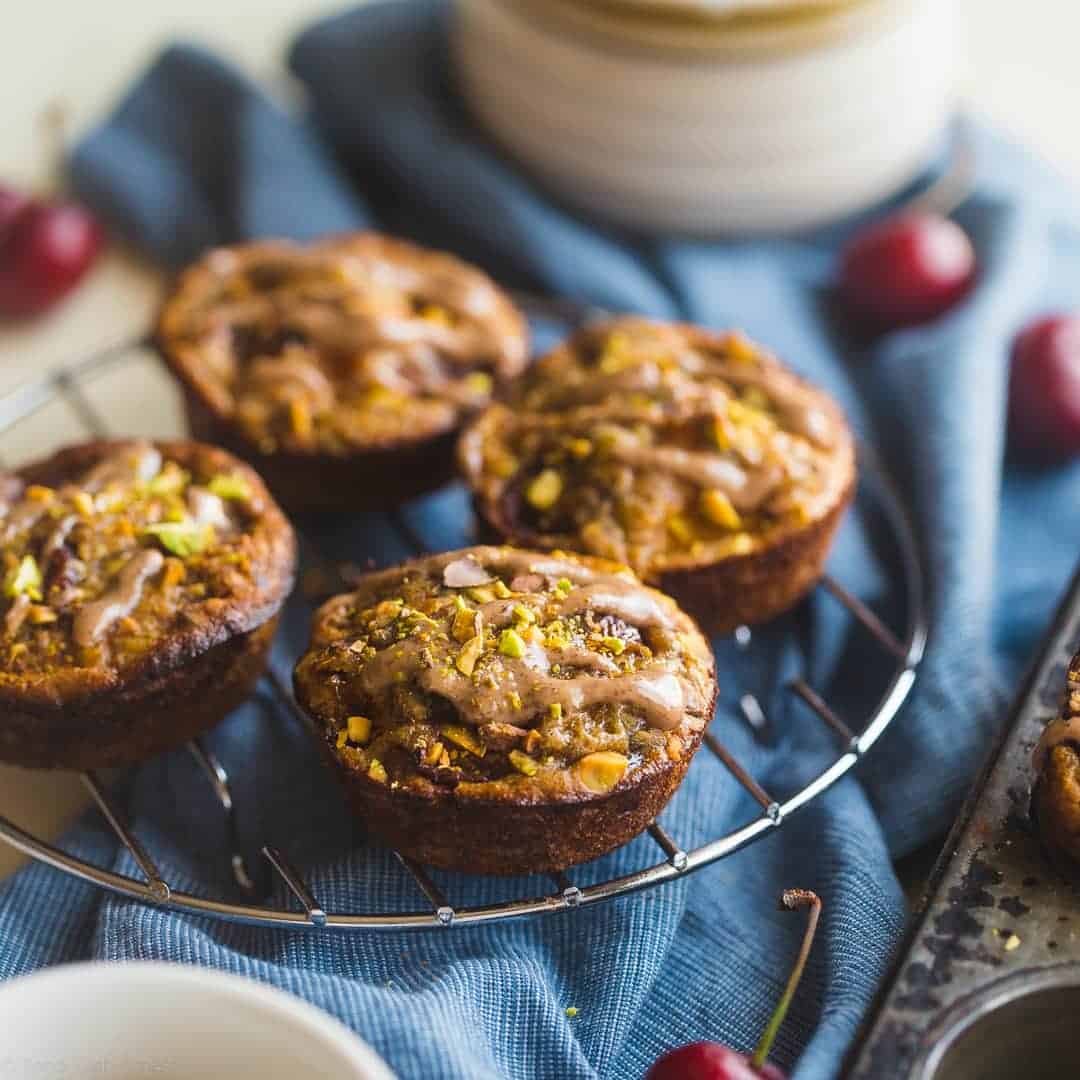 Almond, Cherry and Apricot Quinoa Muffins - These spicy-sweet, healthy quinoa muffins are packed with roasted cherries and apricots! They're an easy, portable breakfast or snack that's gluten free and kid friendly! | Foodfaithfitness.com | @FoodFaithFit