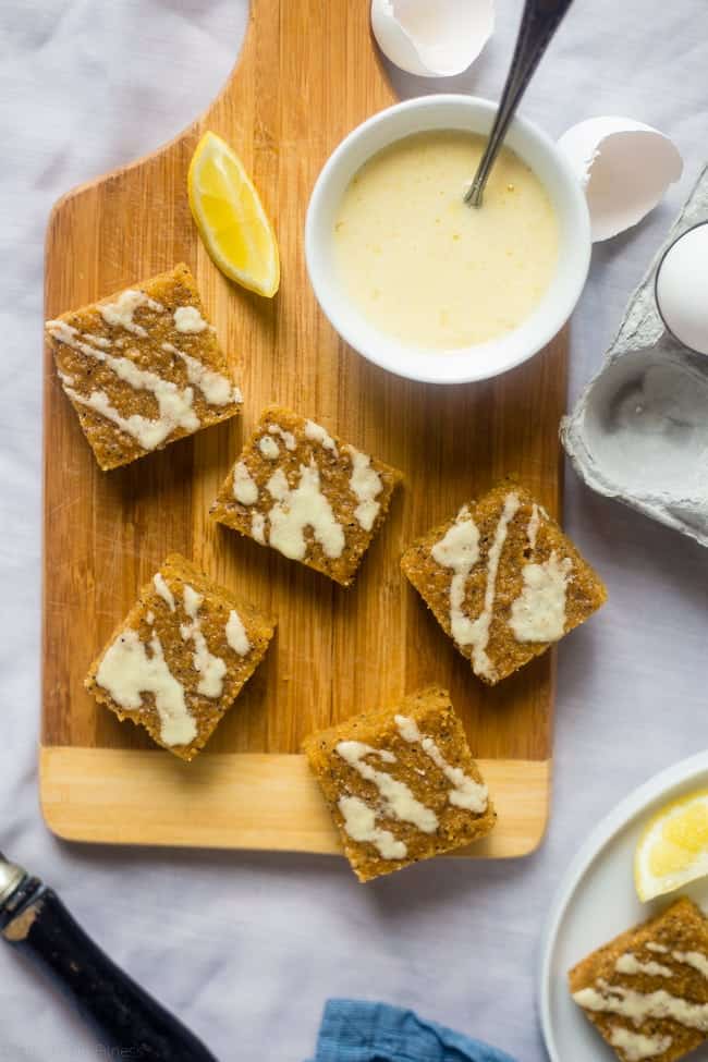 Gluten Free Slower Cooker Lemon Poppy Seed Cake Bars - These easy, low carb cake bars are made in the slow cooker! They're soft, chewy and secretly healthy, gluten/grain free and packed with protein! | Foodfaithfitness.com | @FoodFaithFit