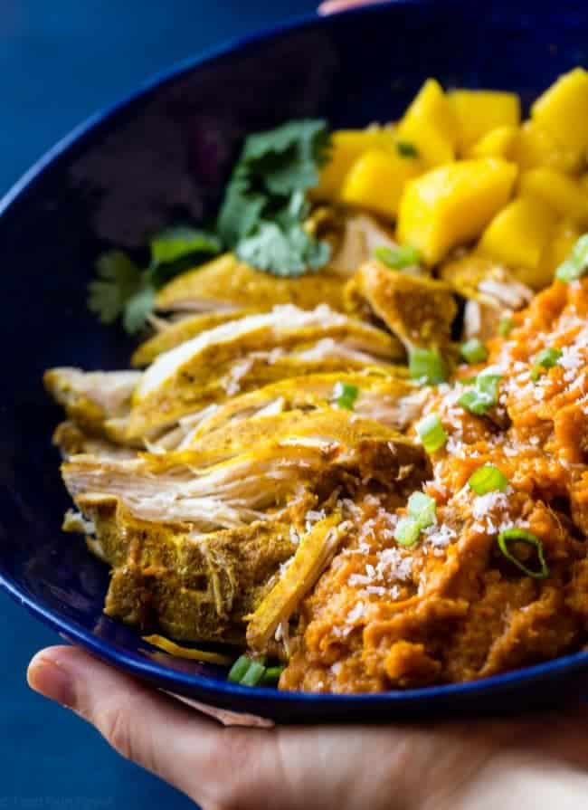 Slow Cooker Mango Chicken and Sweet Potato Bowls - This whole30 approved slow cooker mango chicken has a sweet, tropical sauce and sweet potatoes! It's a healthy, one pot meal that's perfect for busy weeknights! | Foodfaithfitness.com | @FoodFaithFit