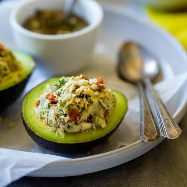 Mediterranean Healthy Tuna Salad Stuffed Avocados - This tuna salad has a Mediterranean twist and is served in an avocado! It has no mayo and is an easy, gluten free and low carb meal with only 6 ingredients! | Foodfaithfitness.com | @FoodFaithFit