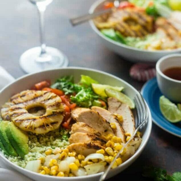 Paleo Mexican Chicken Bowls with Pineapple Grilled Cauliflower Rice - These easy chicken bowls have grilled cauliflower rice and a spicy-sweet pineapple chili sauce! They're a healthy, gluten free dinner that's big on flavor! | Foodfaithfitness.com | @FoodFaithFit