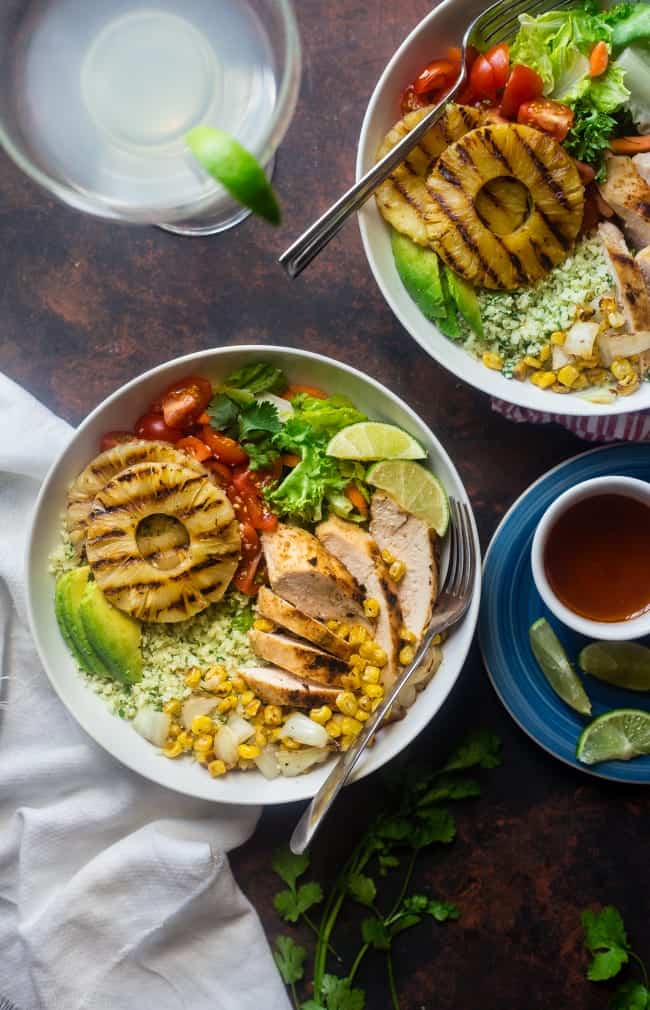 Paleo Mexican Chicken Bowls with Pineapple Grilled Cauliflower Rice - These easy chicken bowls have grilled cauliflower rice and a spicy-sweet pineapple chili sauce! They're a healthy, gluten free dinner that's big on flavor! | Foodfaithfitness.com | @FoodFaithFit
