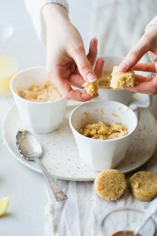 Gluten Free Lemon Macaroon Vegan Mug Cake Recipe - Have cookies IN your cake with this easy, gluten free vegan mug cake that's mixed with crumbled up lemon macaroons. It's a healthy dessert that's ready in under 5 minutes! | Foodfaithfitness.com | @FoodFaithFit