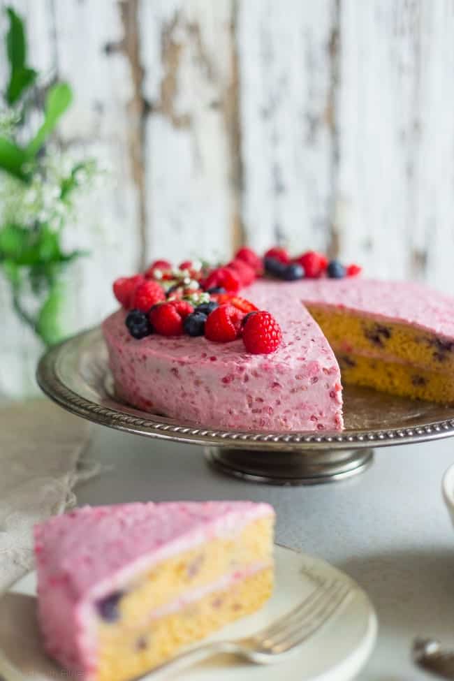 Paleo Blueberry Cake with Raspberry Coconut Cream - This layered paleo cake has fresh, juicy blueberries and raspberry coconut whipped cream! It's a healthier, gluten free dessert that's perfect for summer! | Foodfaithfitness.com | @FoodFaithFit