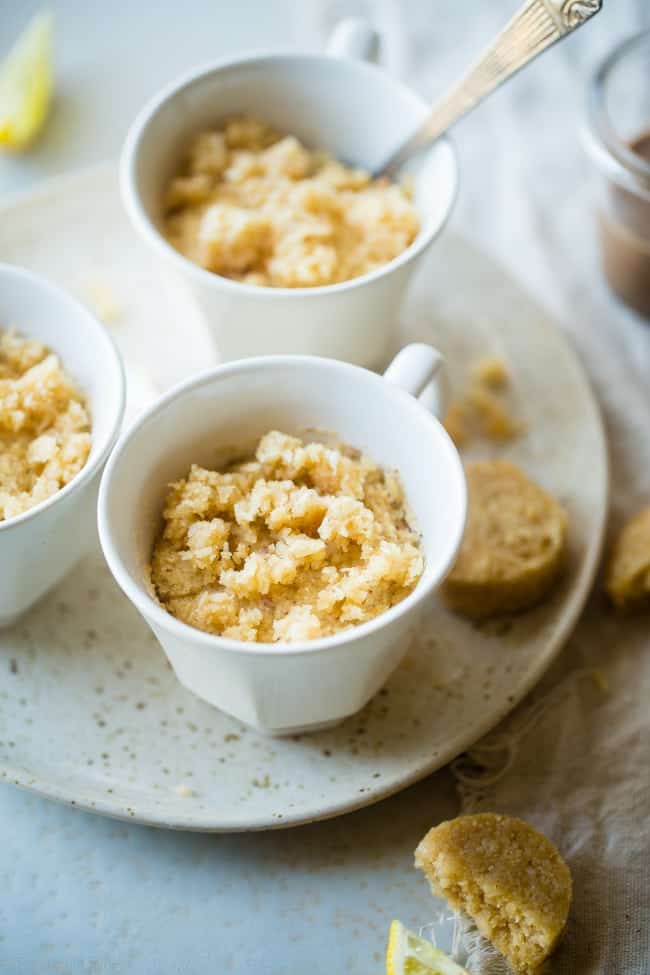 Gluten Free Lemon Macaroon Vegan Mug Cake - Have cookies IN your cake with this easy, gluten free vegan mug cake with coconut flour that's mixed with crumbled up lemon macaroons. It's a healthy dessert that's ready in under 5 minutes! | Foodfaithfitness.com | @FoodFaithFit