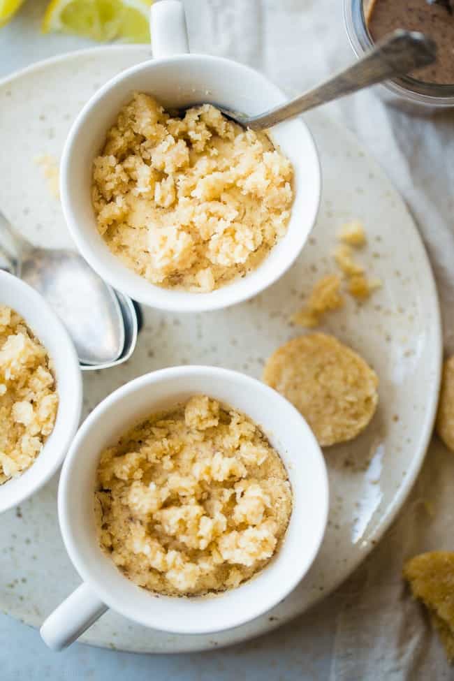 Gluten Free Lemon Macaroon Vegan Coconut Flour Mug Cake - Have cookies IN your cake with this easy, gluten free vegan mug cake that's mixed with crumbled up lemon macaroons. It's a healthy dessert that's ready in under 5 minutes! | Foodfaithfitness.com | @FoodFaithFit