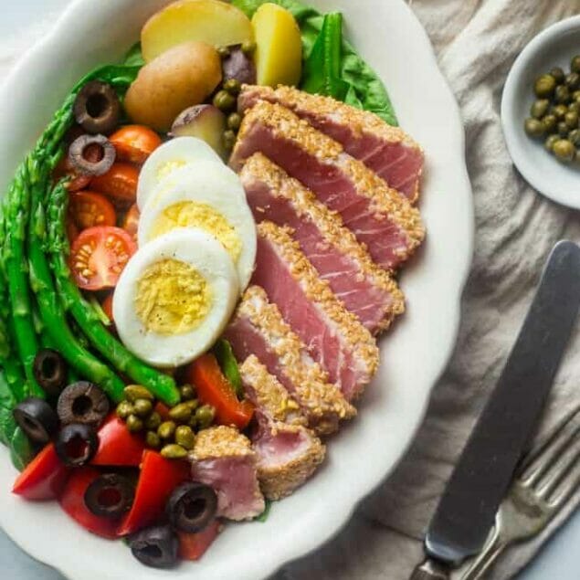 Whole30 Asian Nicoise Salad - This salad is healthy spin on the classic that uses a sesame ginger vinaigrette and seared tuna steaks for a healthy, Whole30 compliant, paleo-friendly meal that's packed with protein! | Foodfaithfitness.com | @FoodFaithFit