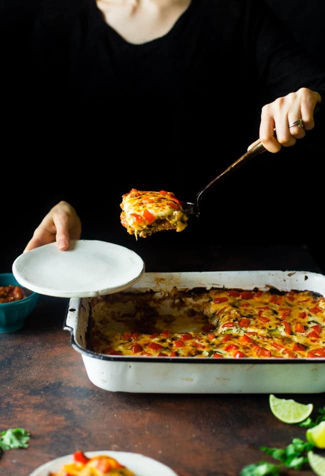 Mexican Zucchini Lasagna - This lasagna has all the cheesy, saucy taste but without the carbs and calories! It's a healthy, gluten free and protein-packed crowd-pleasing dinner that's only 280 calories! Make-ahead and freezer friendly too! | Foodfaithfitness.com | @FoodFaithFit