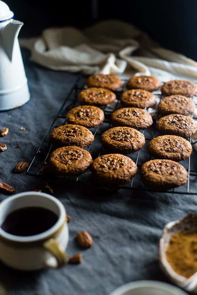 Pecan Pie Paleo Cookies - These easy cookies taste like pecan pie INSIDE a cookie because they have a sticky-sweet, crunchy pecan center! You'll never guess they're gluten free and healthier treat for the holidays! | Foodfaithfitness.com | @FoodFaithFit